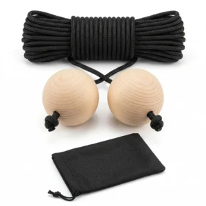 A premium Cornhole distance cord featuring smooth pine wood balls and a durable nylon rope, lying next to a black drawstring storage bag for regulation 27-foot setups.